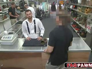 Dude blows a dick behind counter in a shop